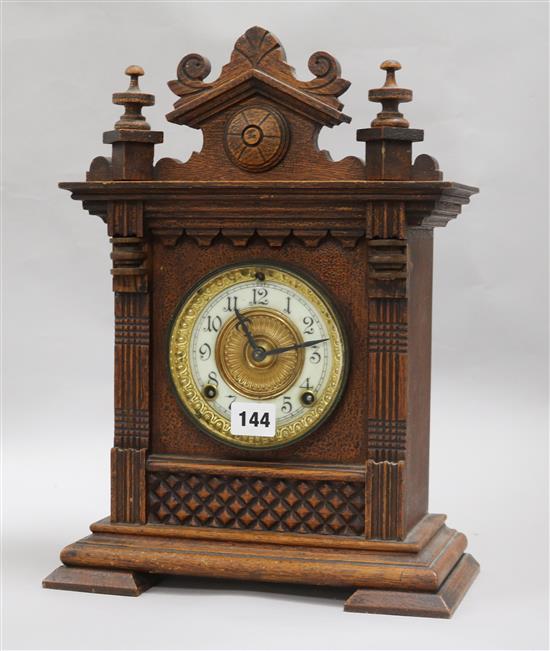 An Edwardian oak cased mantel clock, the dial inscribed Ansonia Clock Co. New York height 38cm